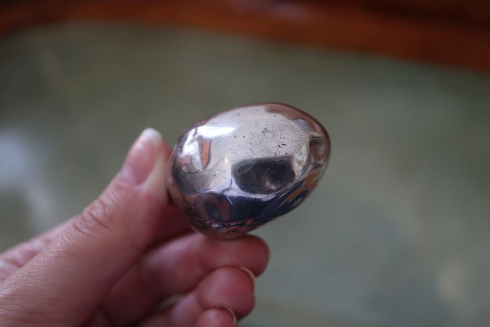 An Edwardian novelty silver mounted pin cushion modelled as a hatching chick, Sampson Mordan & Co